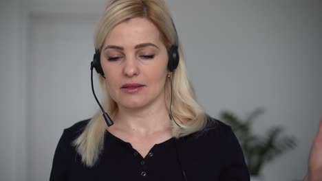 Smiling-confident-young-business-woman-online-teacher-job-applicant-manager-talk-with-client-make-conference-video-call-chat-speak-during-distance-job-interview-look-at-camera-in-office,-webcam-view