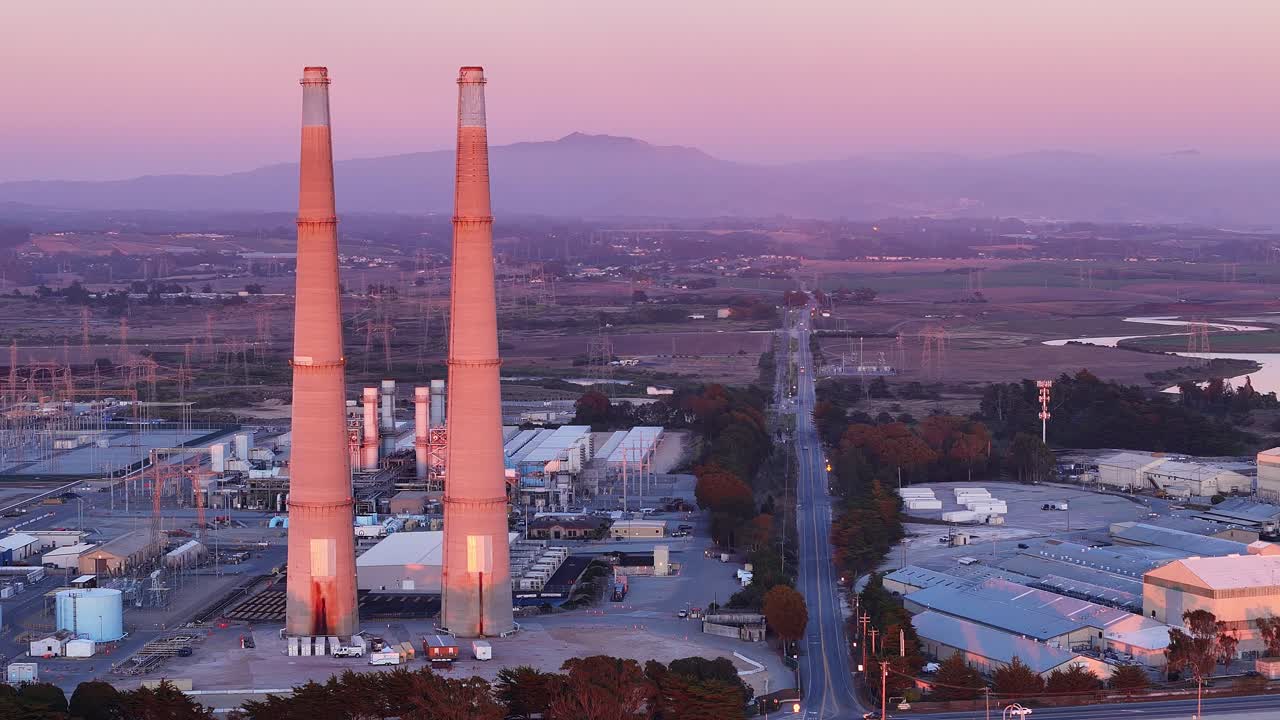 Grid energy battery storage on the site of an old gas fired power plant, one of the largest in the world, Salinas Valley in the background, Moss Landing, California, USA