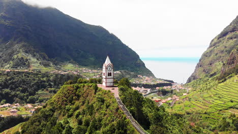 drone turns around church on top of a hill in madeira