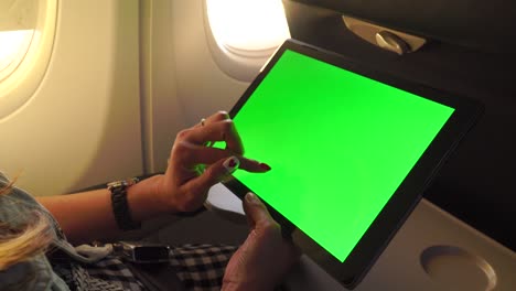 working with laptop tablet pc on aircraft,green screen and chroma key.