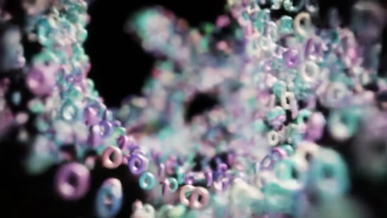 A mesmerizing swirl of colorful numbers and shapes creates an enchanting visual experience, capturing the essence of digital movement and transformation in a fluid display.