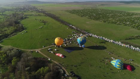 hot air balloon festival in a grassland