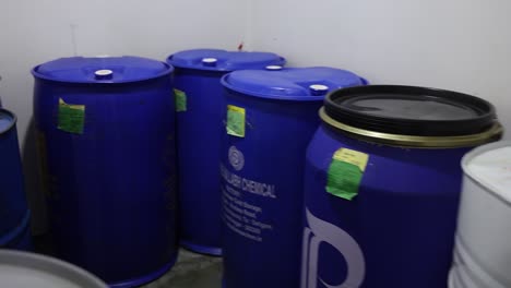 chemical drums and barrels in a warehouse