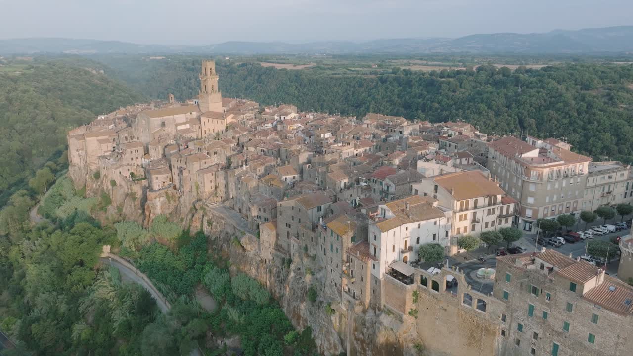 Aerial Drone view of the hilltop Medieval town of Pitigliano, Tuscany in morning light, with the Valdorcia and old buildings, in 4K
