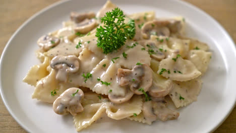 farfalle pasta with mushroom white cream sauce - italian food style