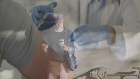 animation of doctor with vaccine over senior man wearing face mask