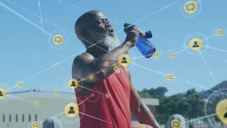 animation of network of connections with icons over senior african american man drinking water