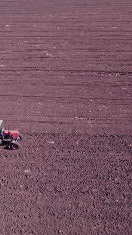 tractor preparing soil for planting new crop next season