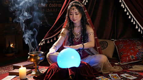 mystical fortune teller with glowing crystal ball and tarot cards
