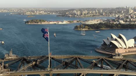 aerial circling over sydney harbor bridge, opera house and cityscape