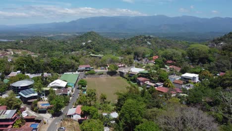 manuel antonio city in costa rica, with its vibrant mix of houses, trees, and mountains, all in one breathtaking video