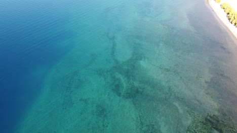 the impressive turquoise color of the water in buenos aires lake