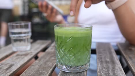 woman enjoying matcha drink outdoors