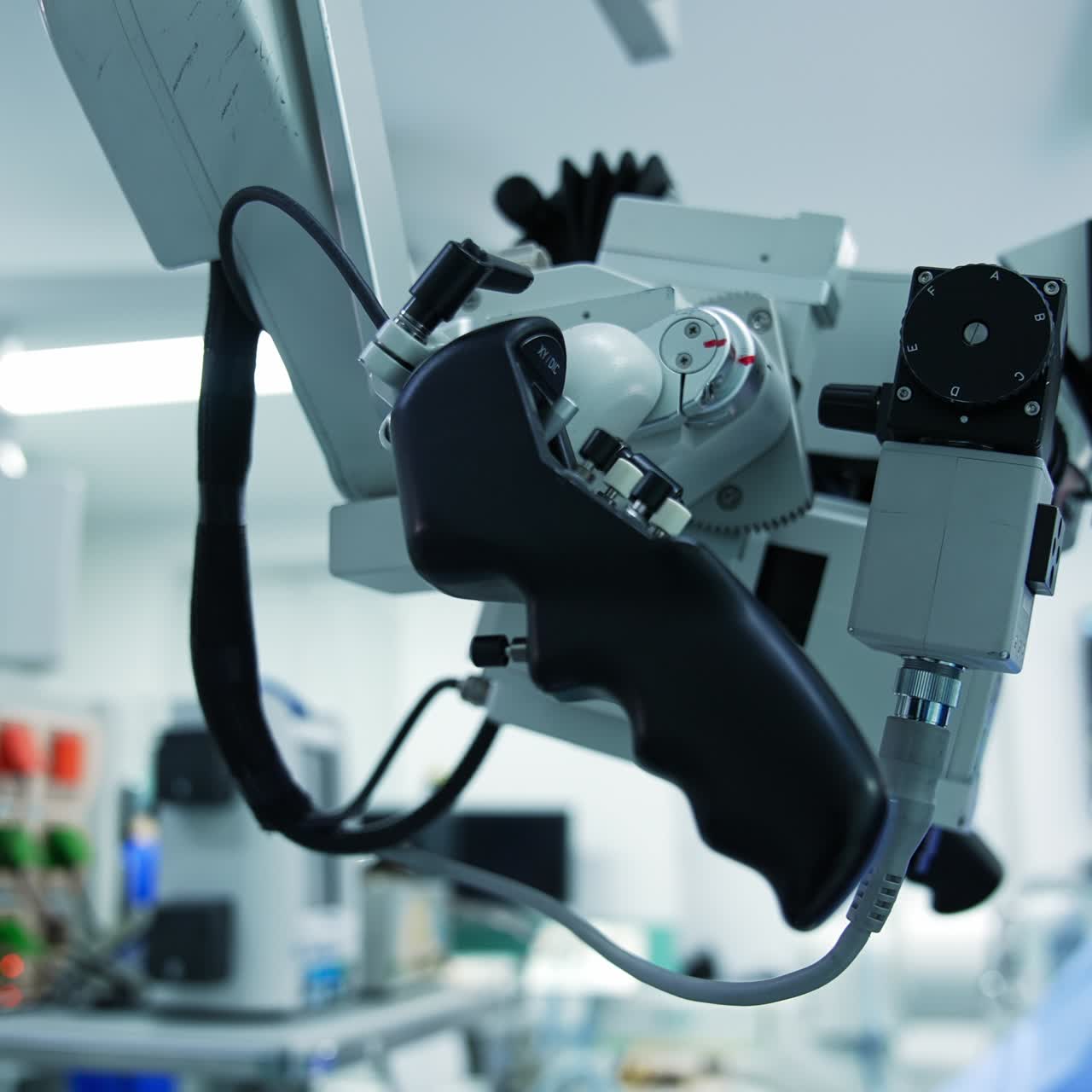 Powerful microscope with handles for easier operating during surgery. Advanced equipment in modern surgery room