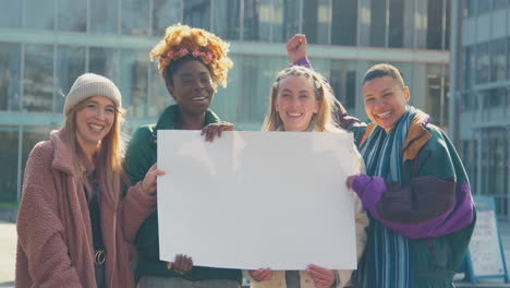 Portrait-Of-Female-Protestors-With-Blank-Placard-On-Demonstration-March