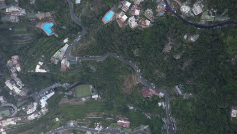 Vertical-aerial-of-traffic-on-dramatic-twisted-Amalfi