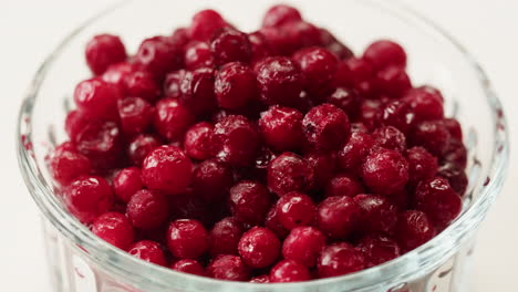 frozen cranberries cooking for tea or jam, background close up of cranberry berries in on the kitchen, chef making dessert healthy pie.