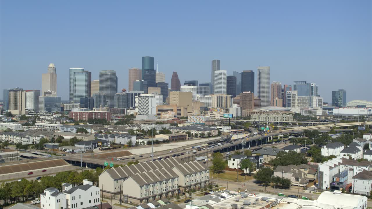 Establishing drone view of clear blue sky over downtown Houston, Texas