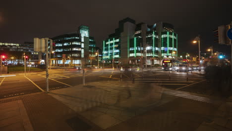 time lapse of nighttime road traffic and people walking by in dublin city centre in ireland