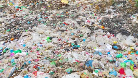 Looking-down-onto-a-sprawling-landscape-of-trash-and-rubbish-as-far-as-the-eye-can-see