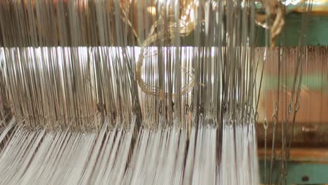 Closeup-of-weaving-machine-in-action.-Process-of-fabric-production