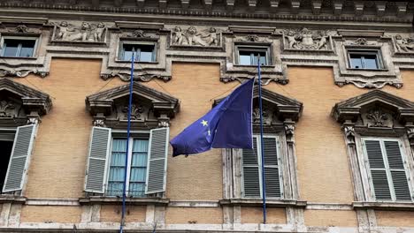 the european community flag waving from an ancient building.