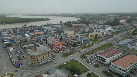 foggy morning beautiful drone view of sri aman town at batang lupar river, during regatta and pesta benak,sarawak, borneo.