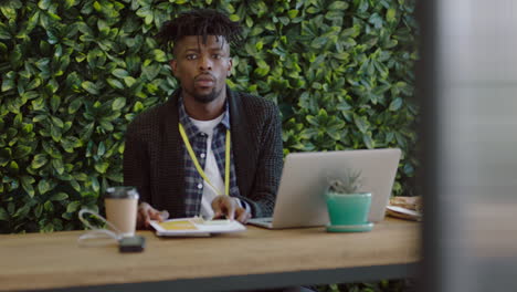 bored businessman at work young african american man looking unmotivated expressing boredom lazy employee in workplace