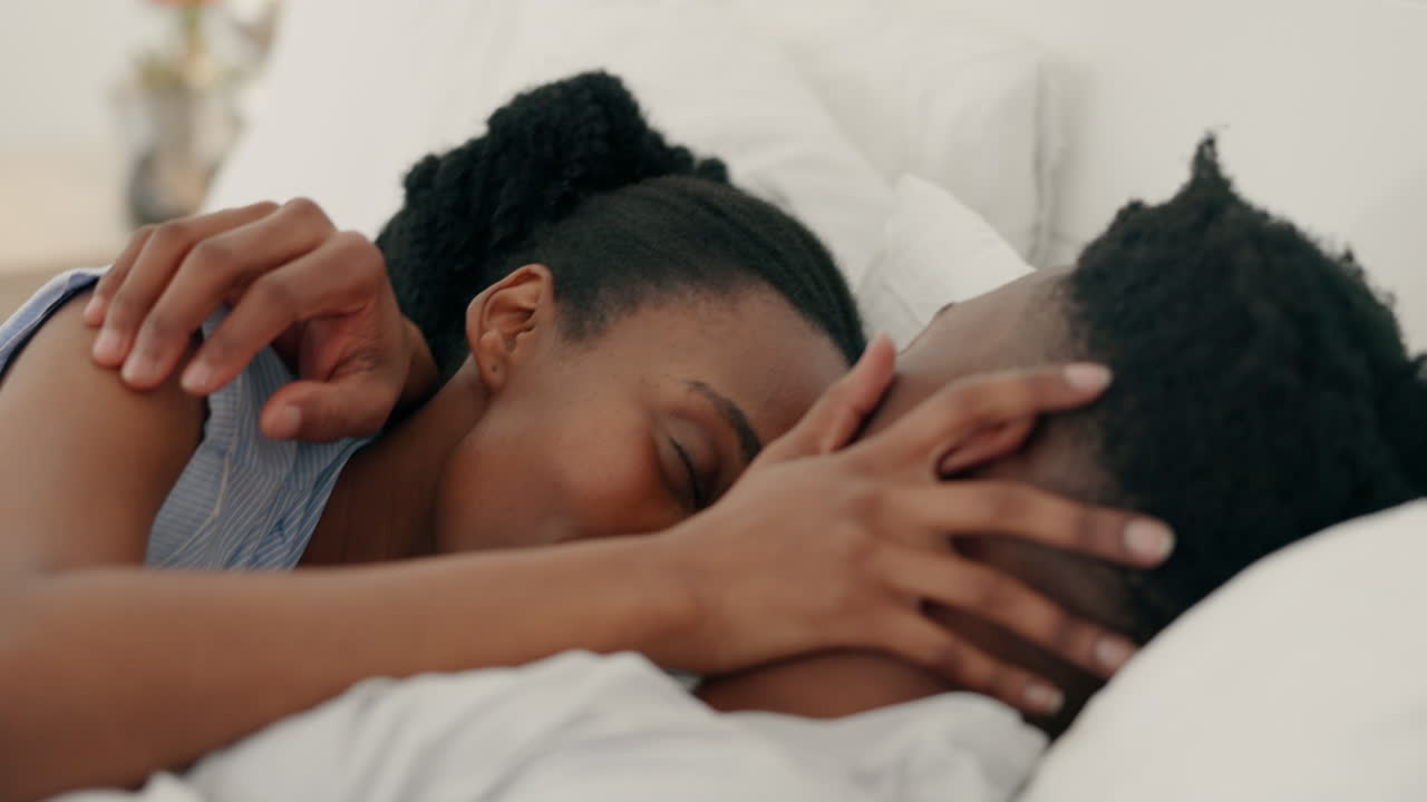 Love, hug and kiss bedroom black couple relaxing