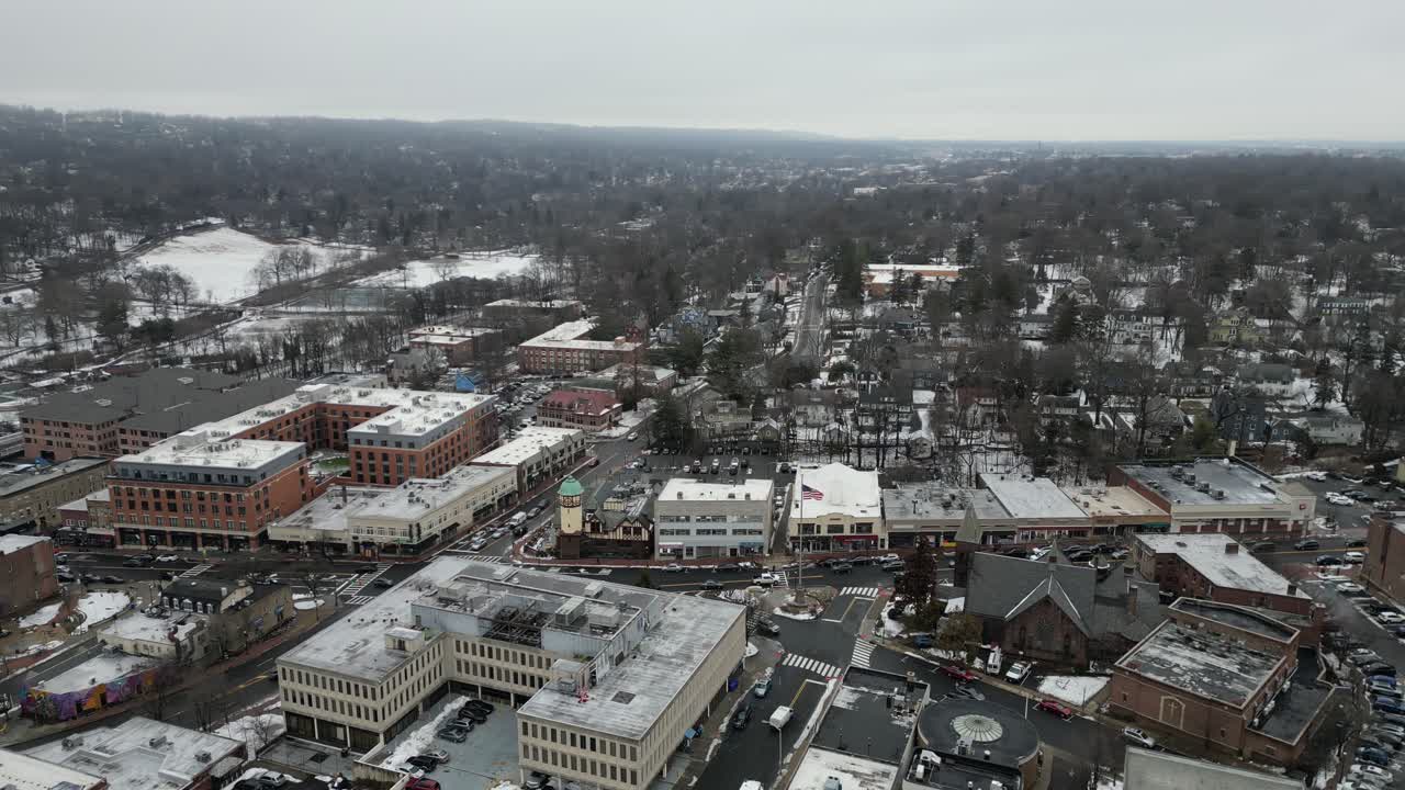 Aerial drone footage of South Jersey in winter, featuring snow-covered rooftops, streets, and urban areas. Capturing the cold season’s atmospher