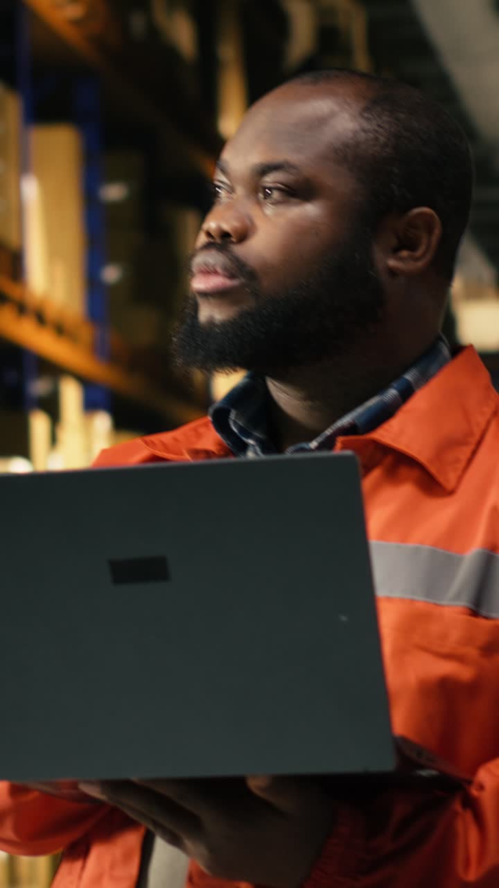 Vertical Video Portrait Of African American Staff Organizing Storage Racks With Parcels