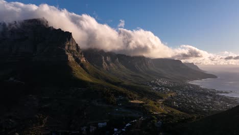 dramatic thick clouds rolling over twelve apostles cliffs in sunset - drone