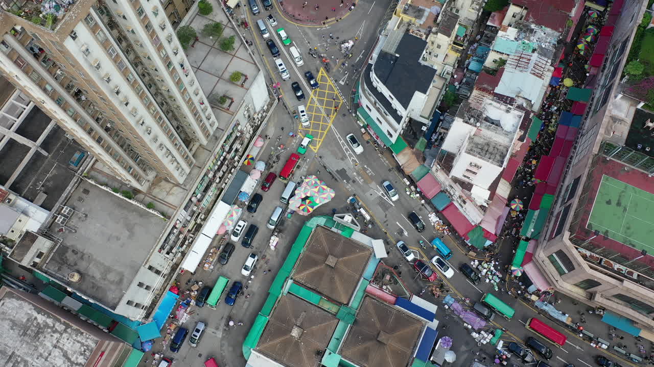 Traffic Jam On The Streets With Modern Buildings In Hong Kong. aerial top-down
