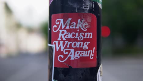 Sticker-at-a-street-lamp-or-pillar-saying-that-we-should-make-rasicm-wrong-again-against-racism-and-that-black-lives-matter