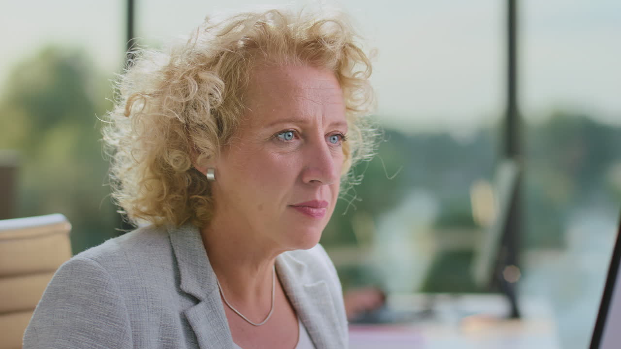 Businesswoman Focused at Computer in Office