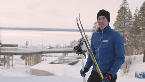 man cross-country skiing in snowy landscape