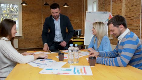 business team meeting involved diverse people participating in creative sustainable ideas steadicam shot across boardroom table shared work space