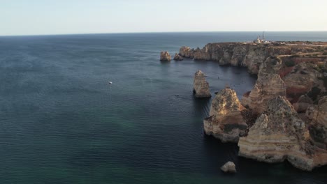 Aerial-view-of-Ponta-da-Piedade-rock-formations-in-Lagos,-Portugal