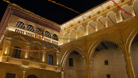 Exterior-Of-Town-Hall-In-Alcañiz,-Spain-At-Night---panning-shot