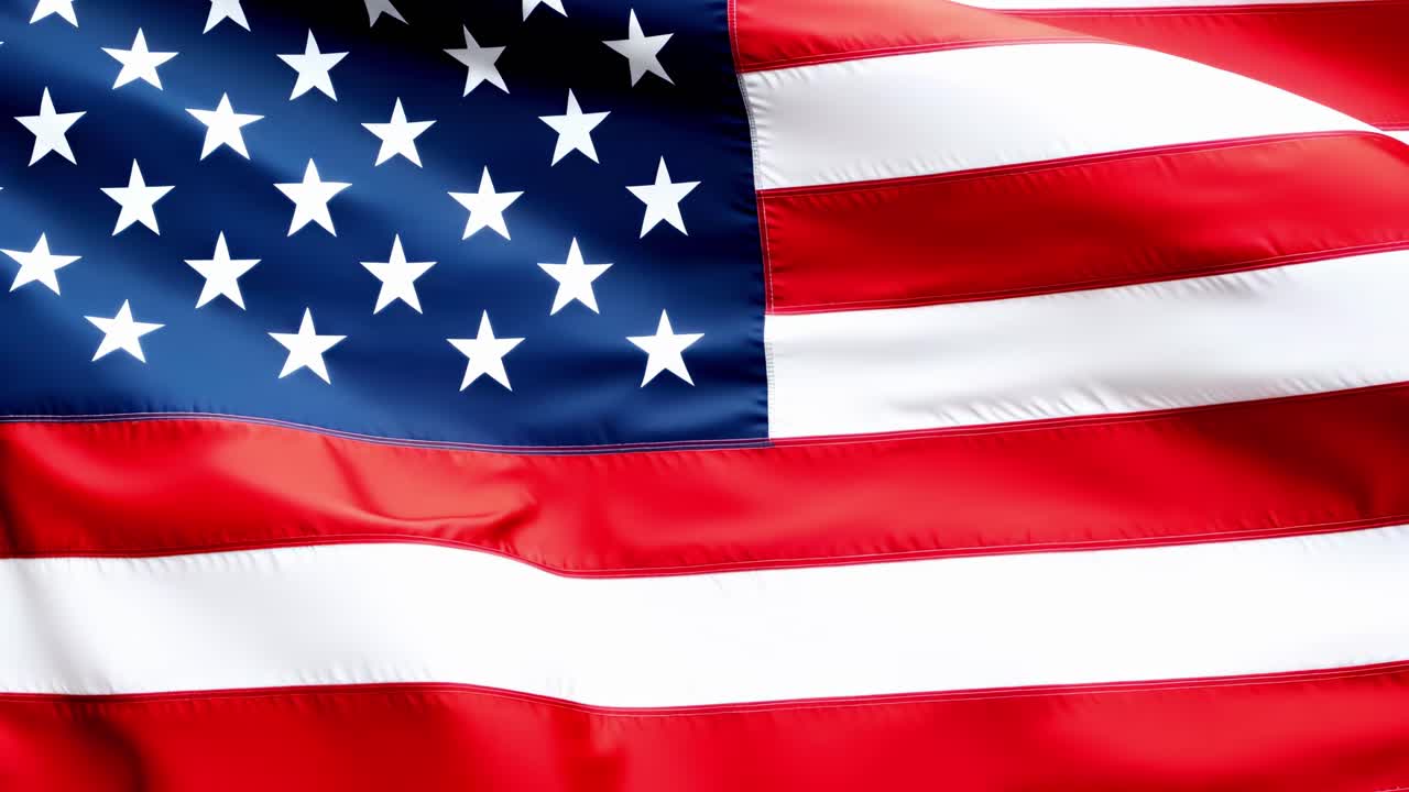 Close-up of a waving American flag, showcasing vibrant colors and stars