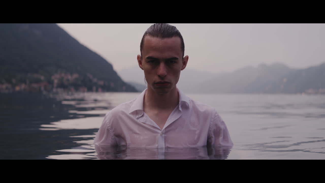 Man in a White Shirt in a Lake
