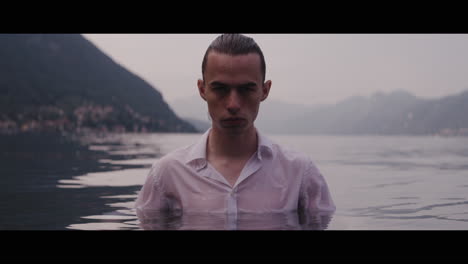 man in a white shirt in a lake
