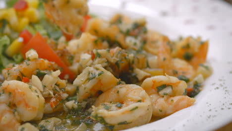 garlic shrimp with fresh salad, close-up, mediterranean