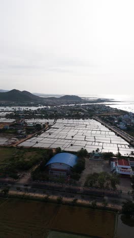 aerial vertical of the mountains and the farm in phan rang–tháp chàm in the morning.