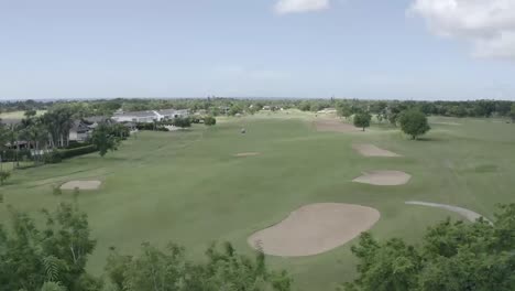 Aerial-images-of-people-on-a-golf-course-playing-sports-game-in-Romana,-Dominican-republic