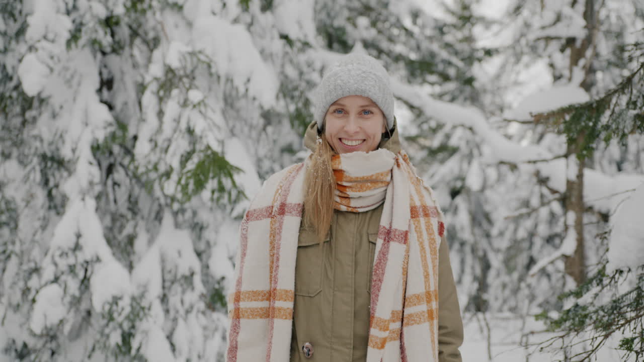 Woman Smiling in a Snowy Forest