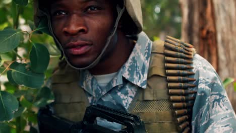 military man with a gun looking around