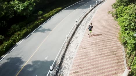 person jogging on a path in a park
