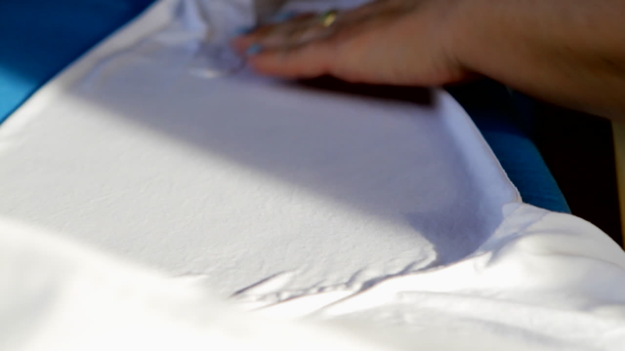 Ironing a white shirt