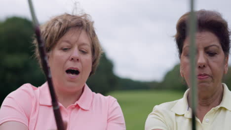 two women learning golf
